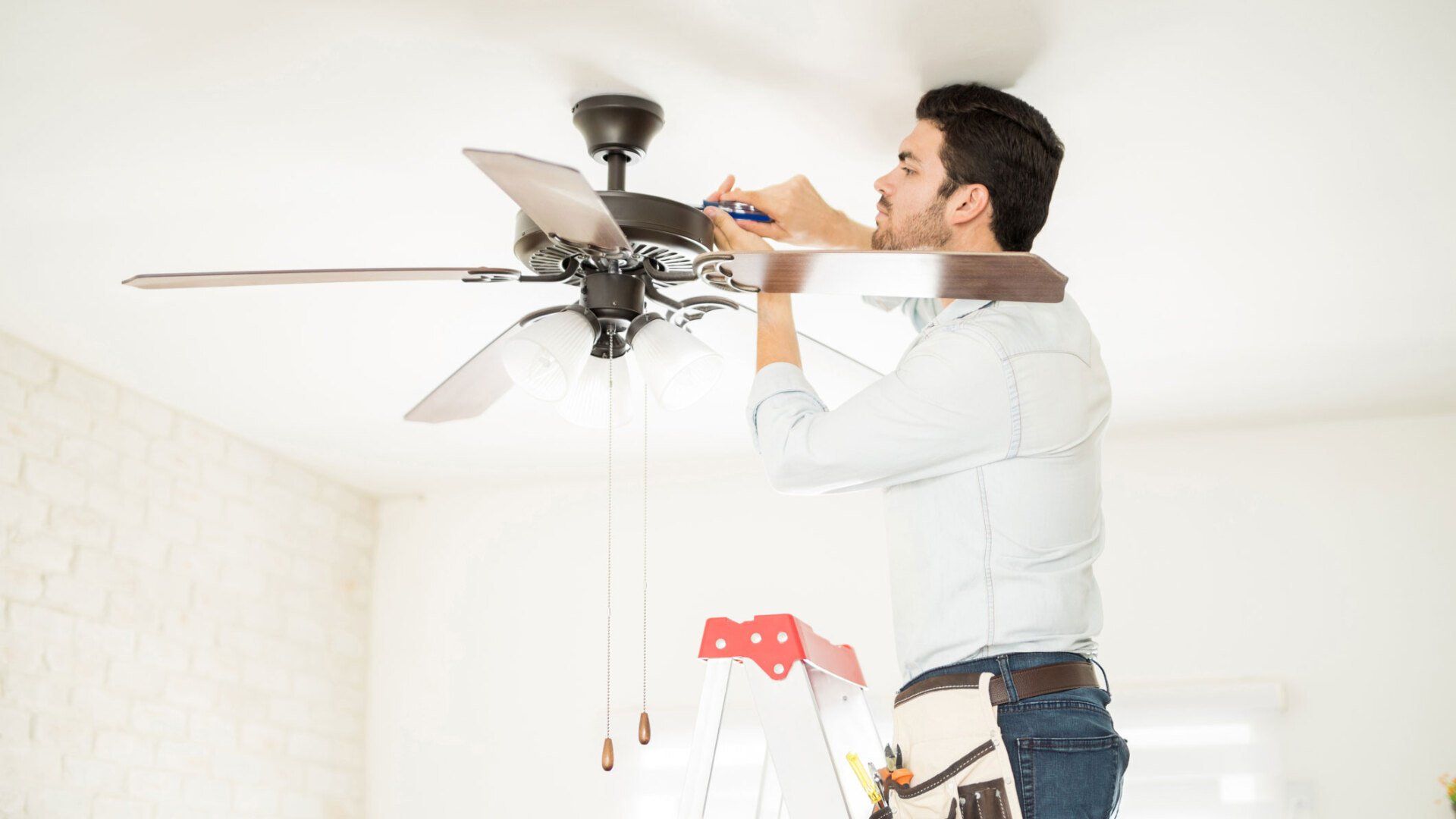 Man Installing Ceiling Fan — Dana Point, CA — Meraw Electric