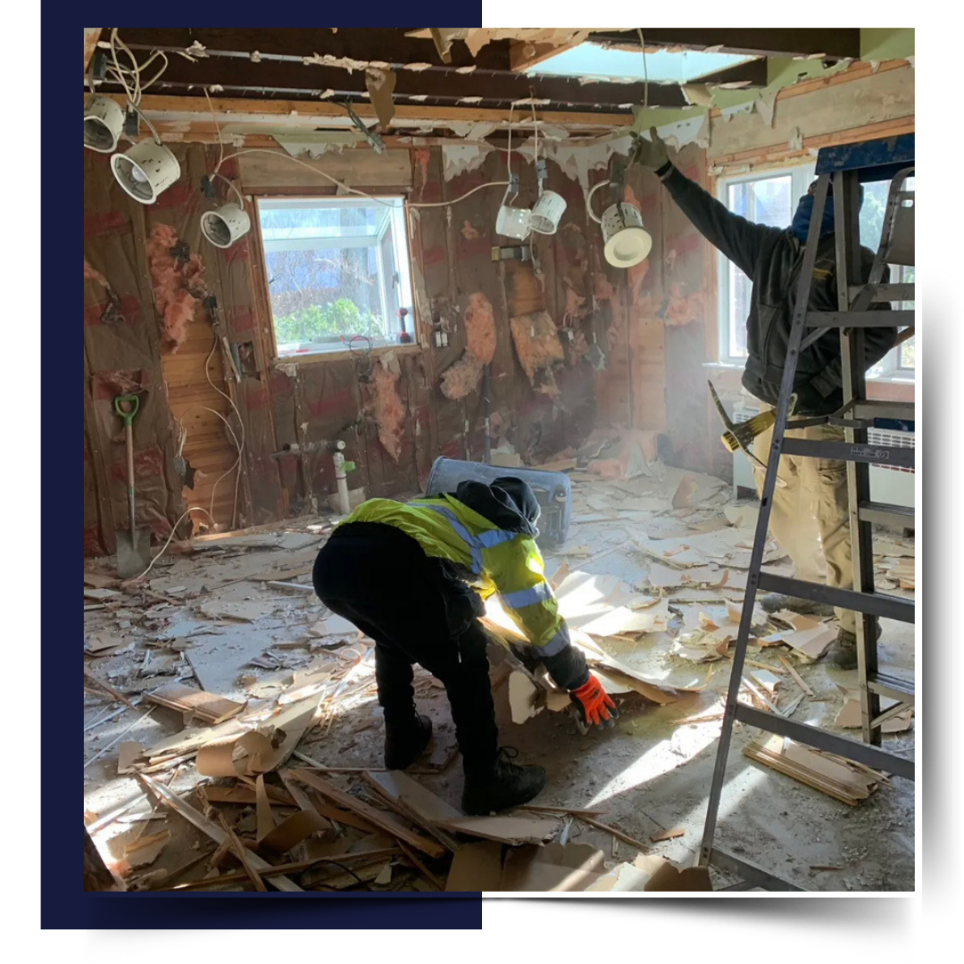 Two men working on a demolition job site