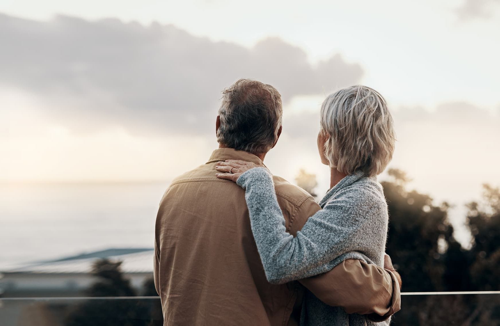 A person is writing on a checklist in a notebook.
