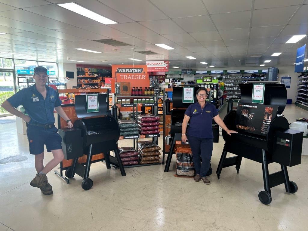 Man And Woman Standing At BBQs — Gloucester Rural Supplies in Gloucester, NSW