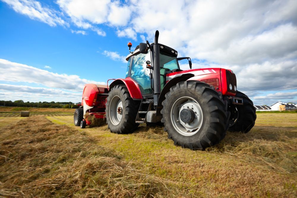Huge Tractor Collecting Haystack — Gloucester Rural Supplies in Stroud, NSW