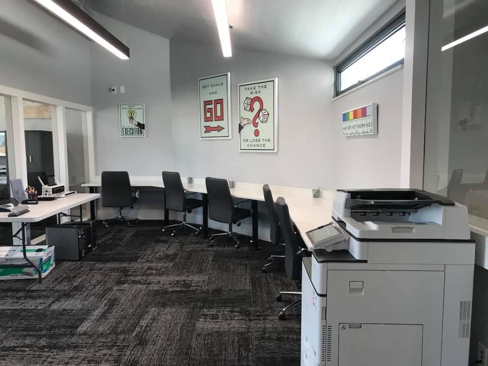 There is a printer in the middle of the room.