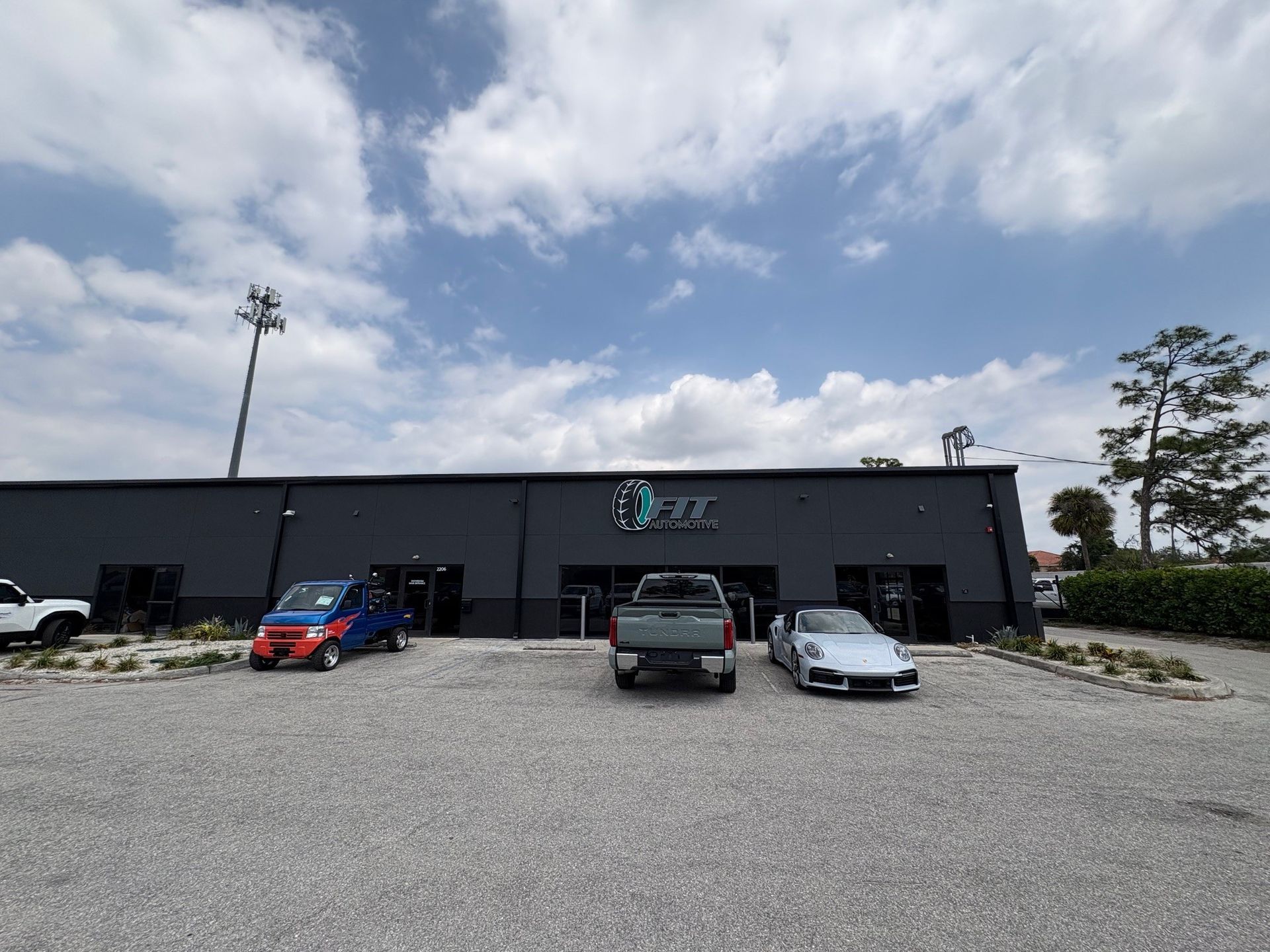 Exterior of a gray building with the logo 