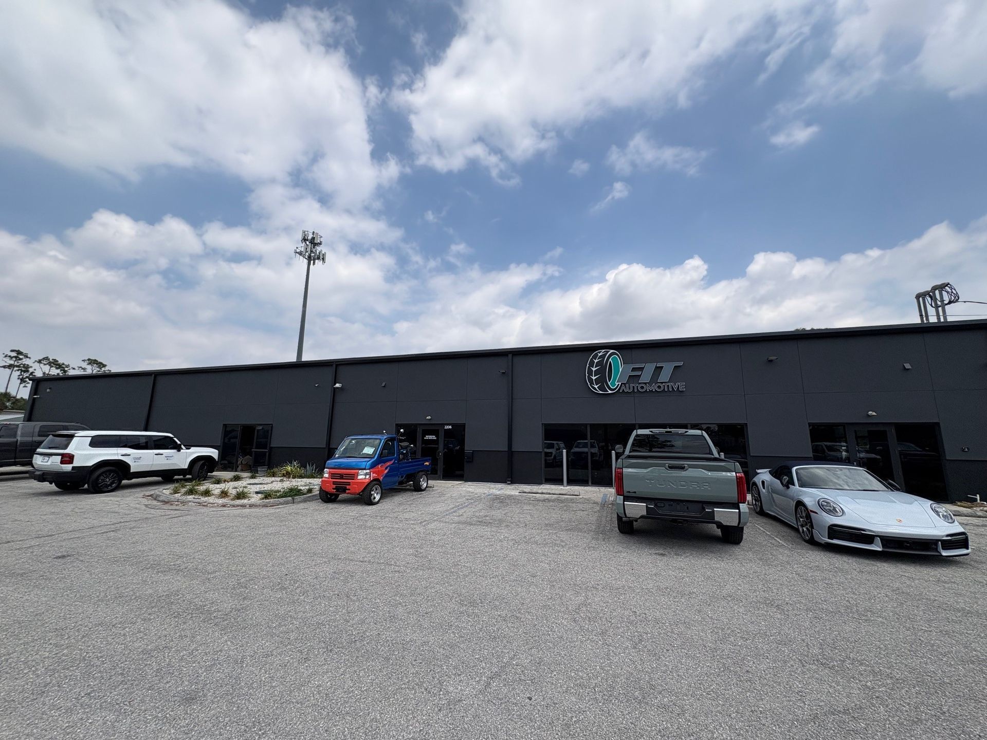 Exterior view of a dark-colored building with the word 