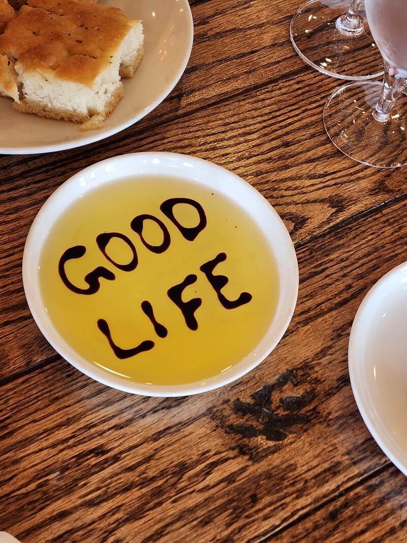 A bowl of good life sits on a wooden table