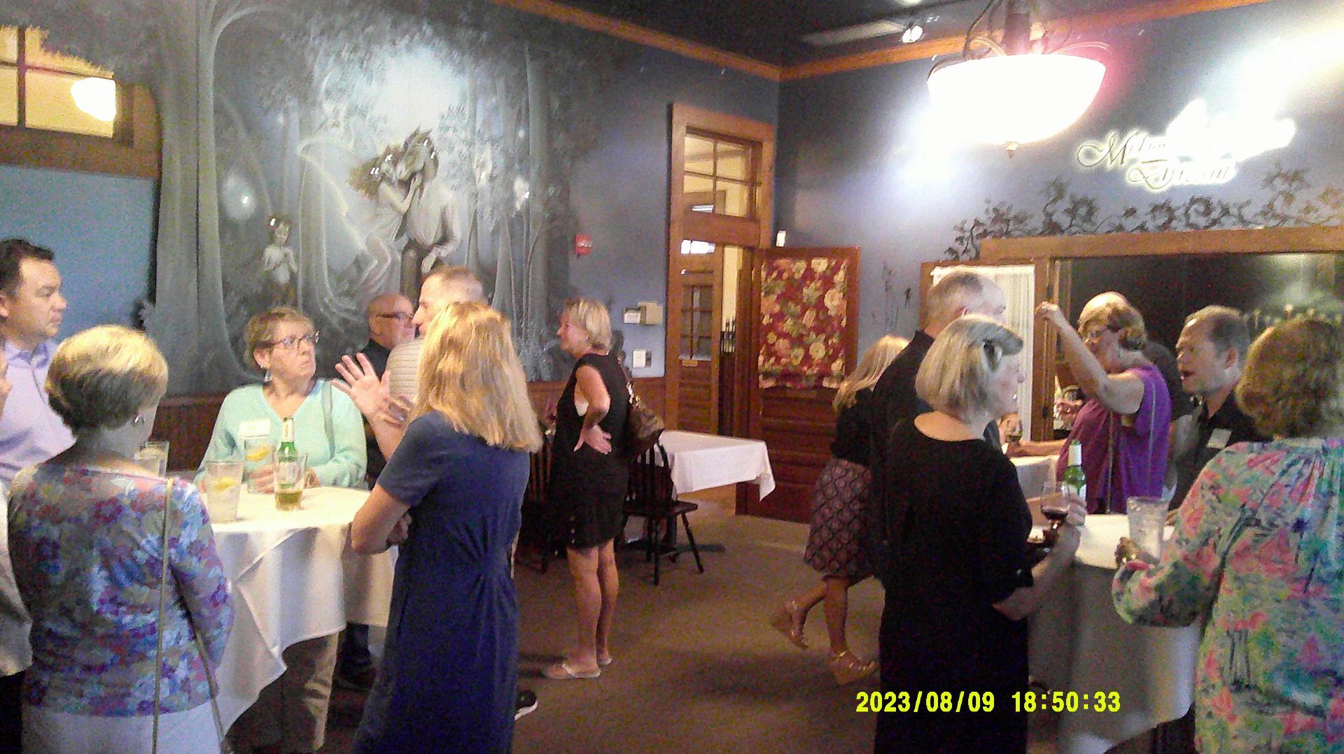 A group of people are dancing in a room.