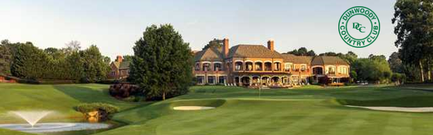 A golf course with a large house in the background