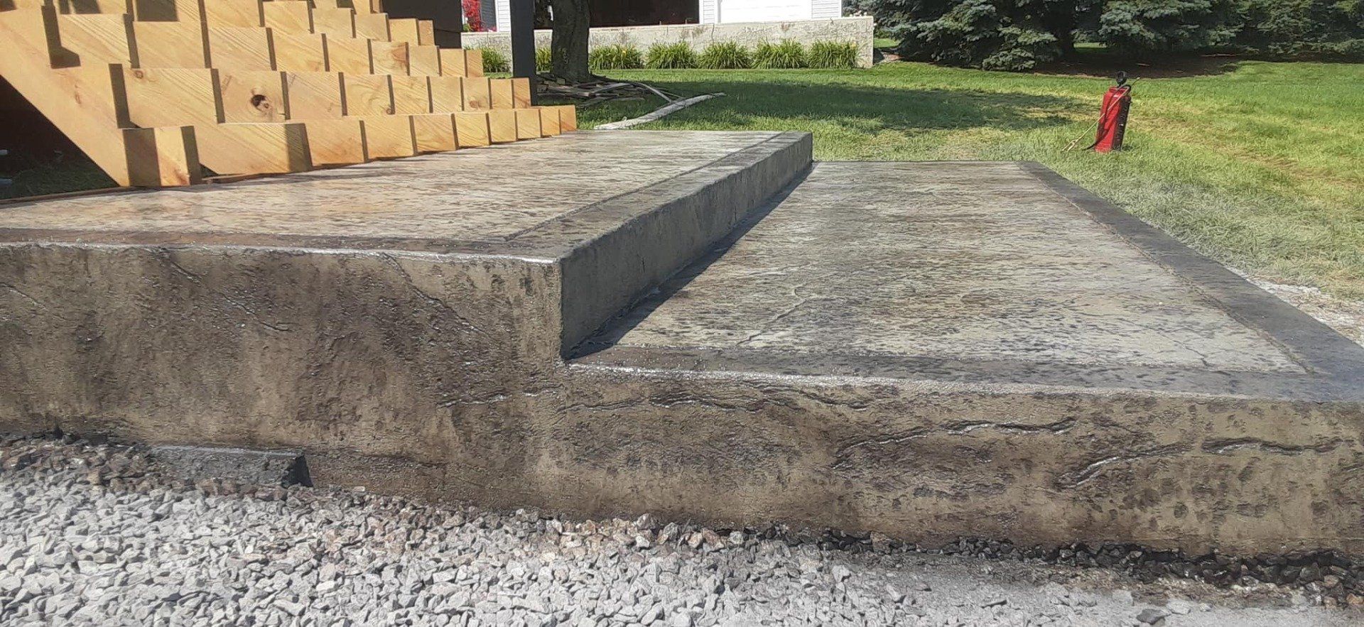 A concrete staircase with a fire hydrant in the background.