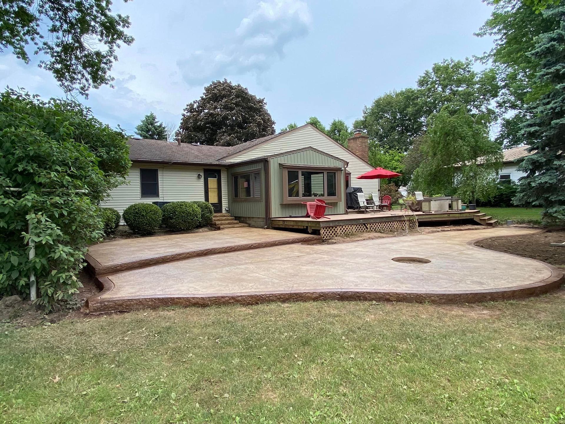 A house with a large patio in front of it