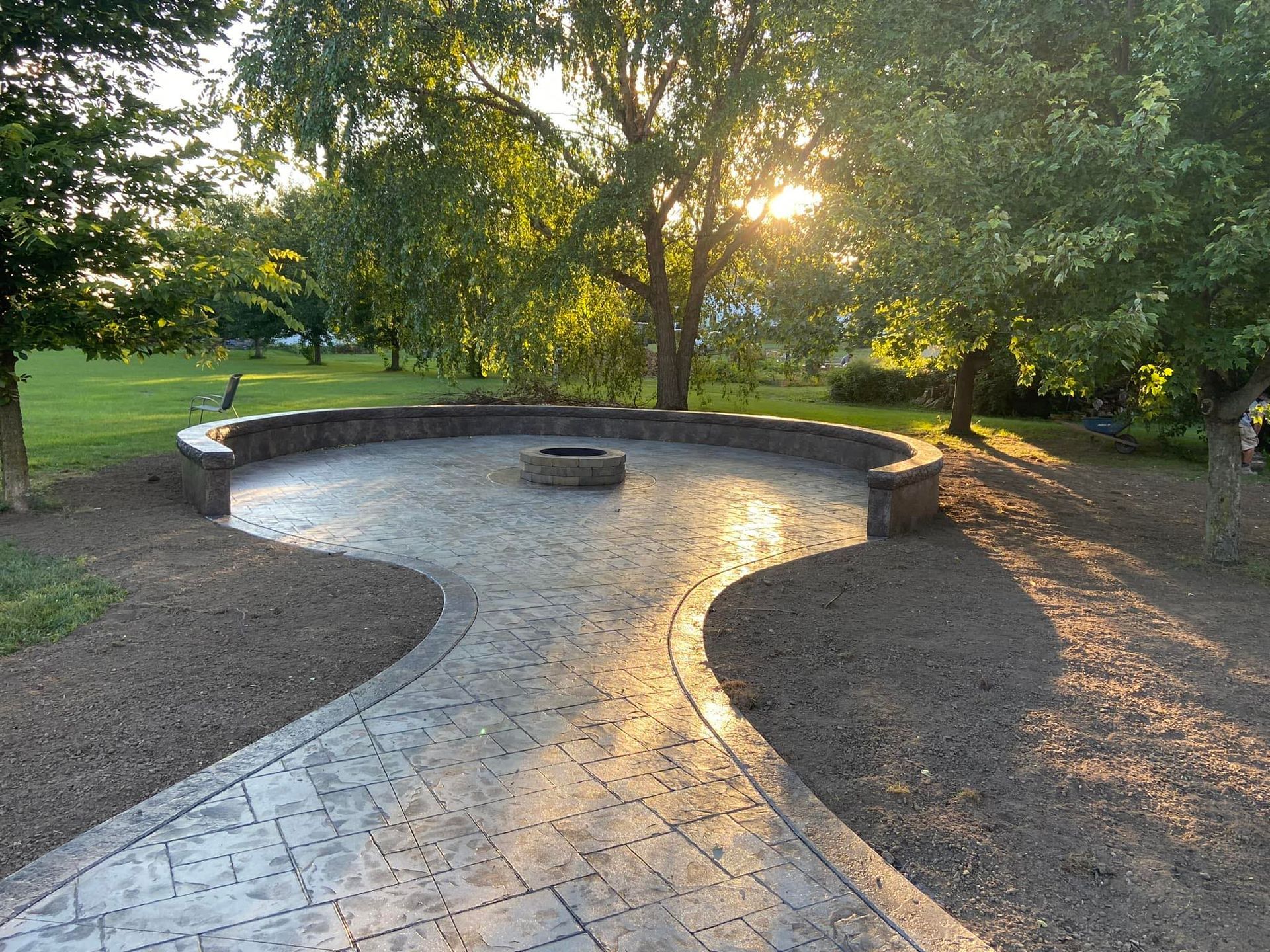 There is a fire pit in the middle of the patio.