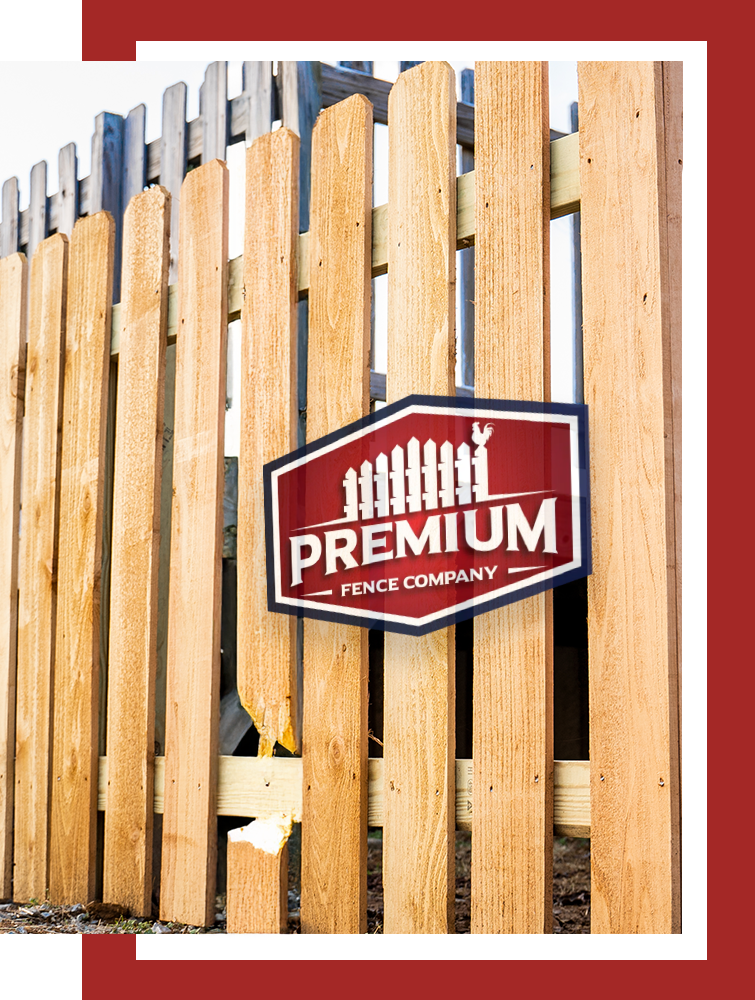 A wooden fence with a sign that says premium fence company