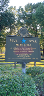 A church with rows of wooden benches and a podium