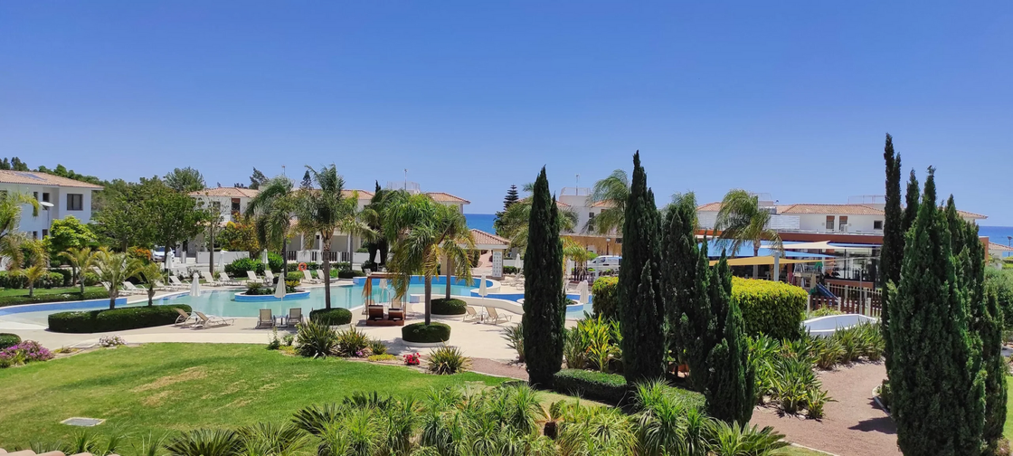 There is a large pool in the middle of the resort.