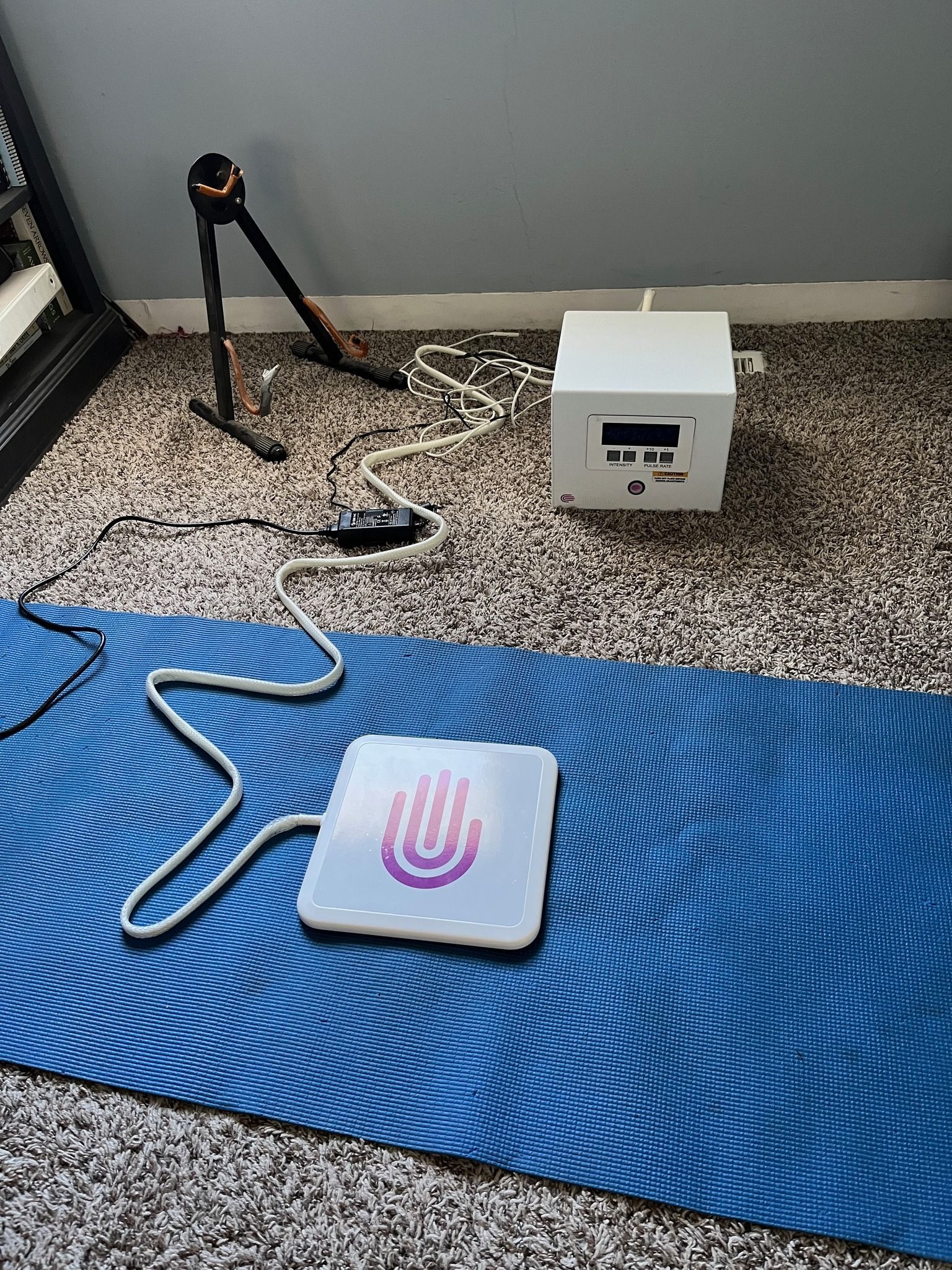 Person receiving acupuncture treatment on their back, with needles inserted.