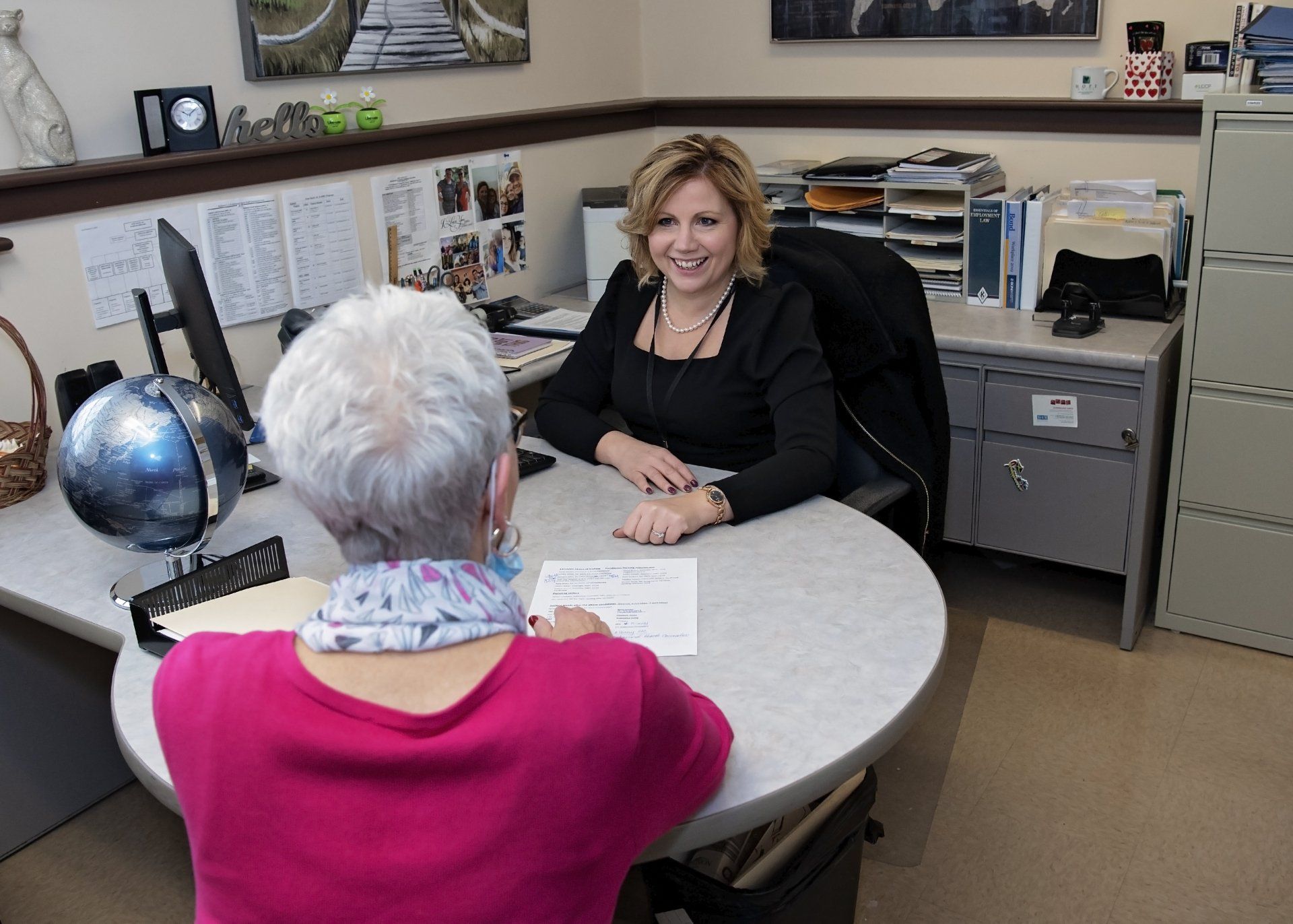 Heather Peabody With a Woman Holding Documents | Albany, NY | Hope House Inc