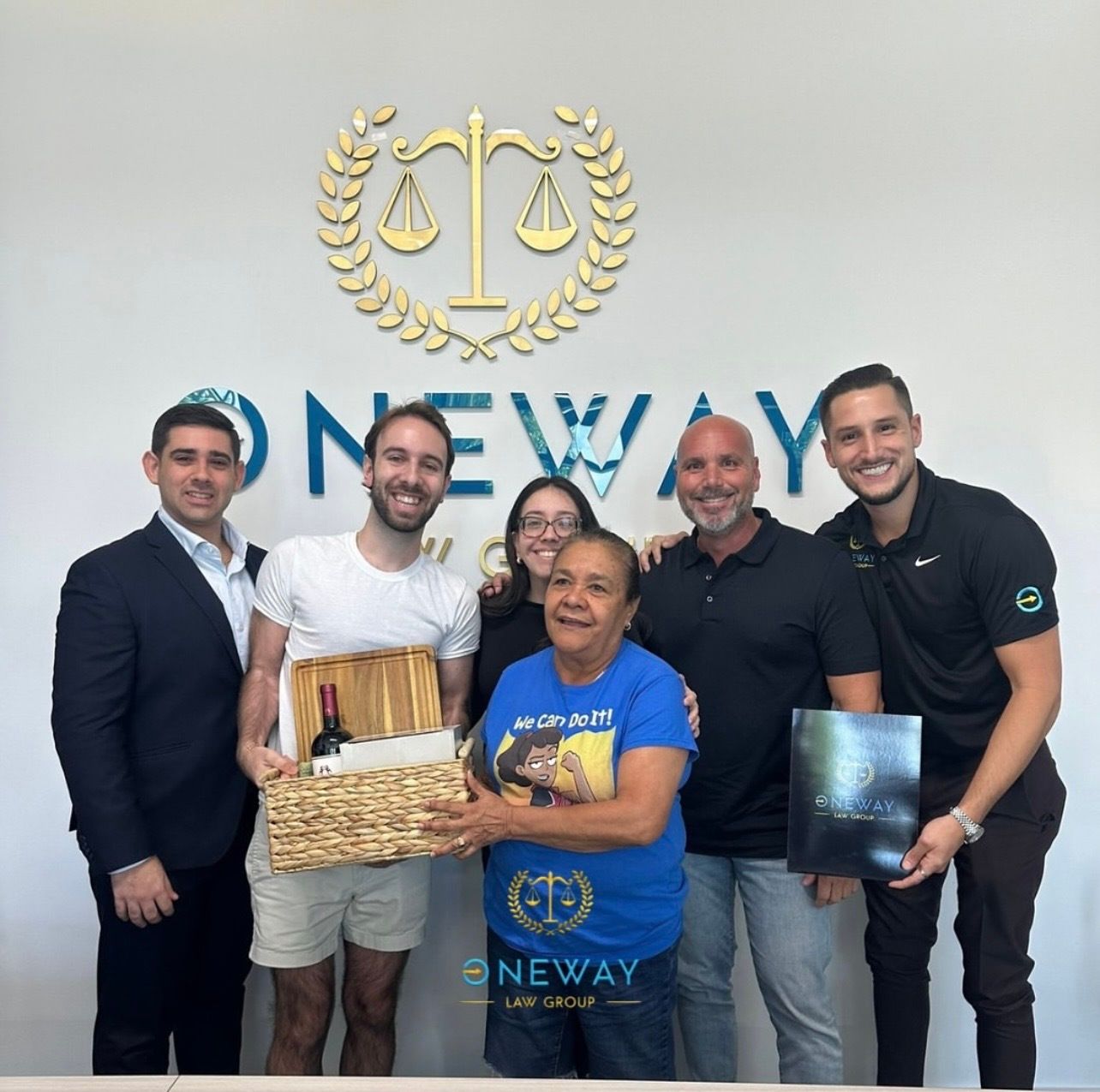 A group of people standing in front of a oneway sign
