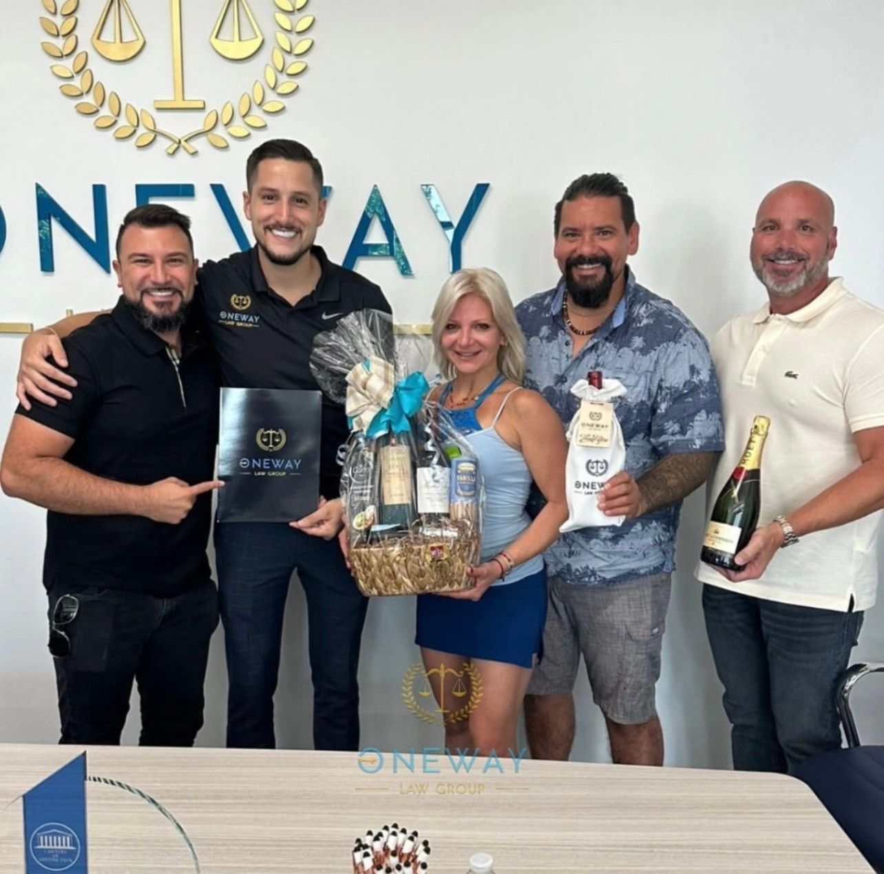 A group of people standing in front of a sign that says one way