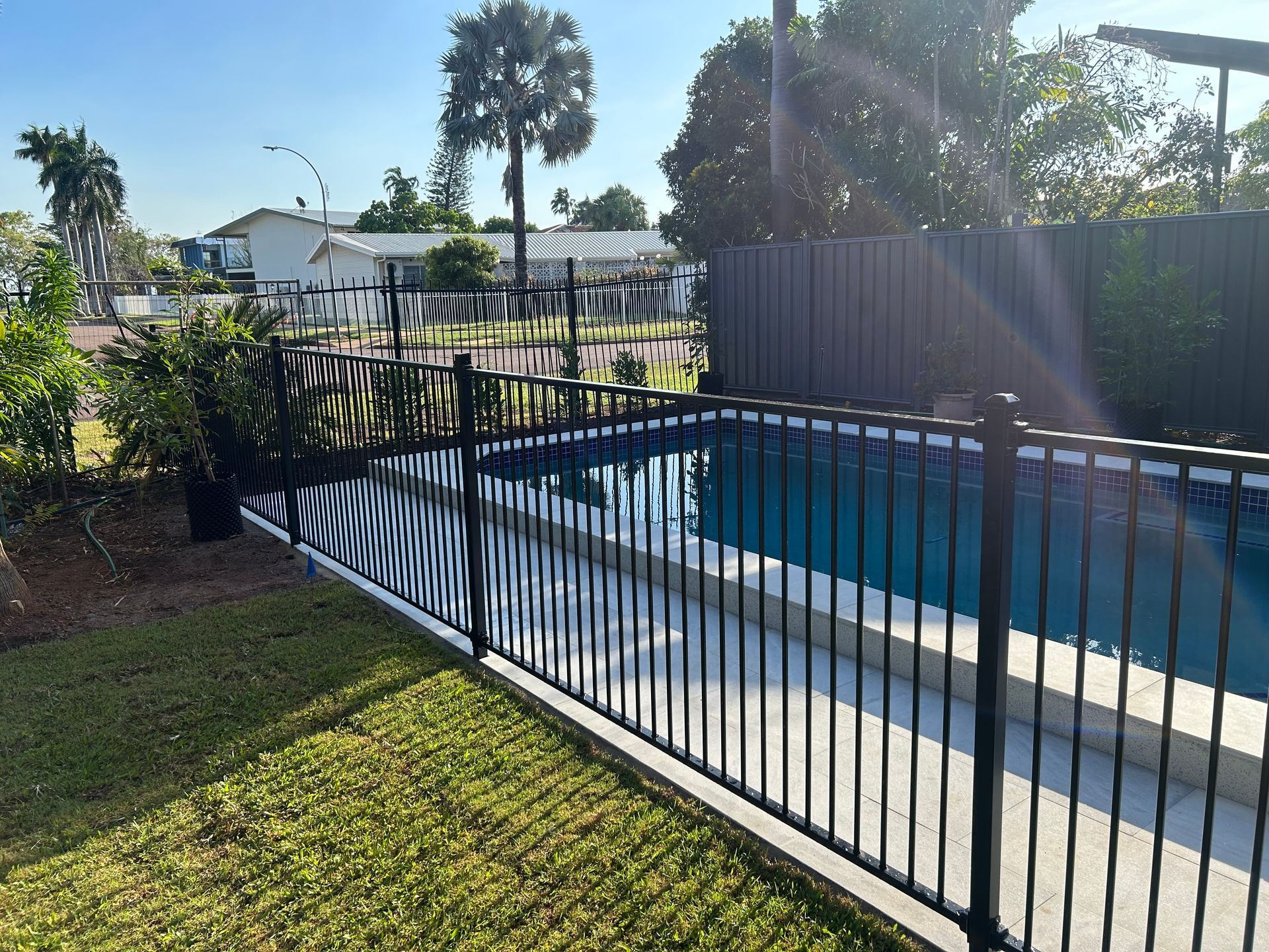 Black Fences Around The Pool Area