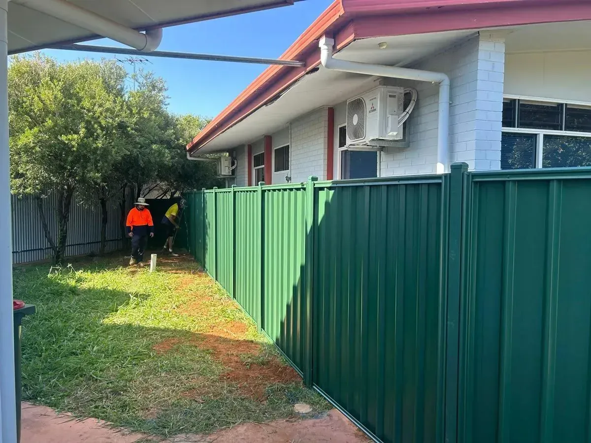 Privacy Fencing In Darwin With Green Colorbond Panels Installed Beside A Residential Home Backyard