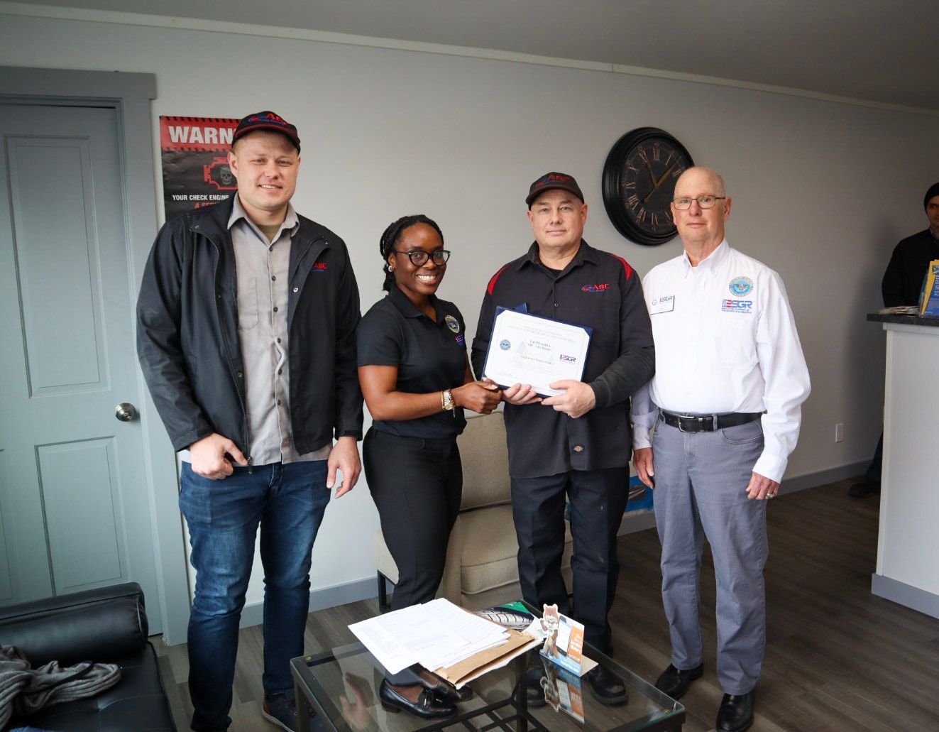 Val receiving ESRG Patriot Award at ABC Auto Repair in Burien