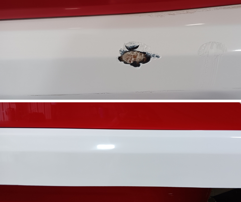 A boat on a trailer is parked in front of a building.