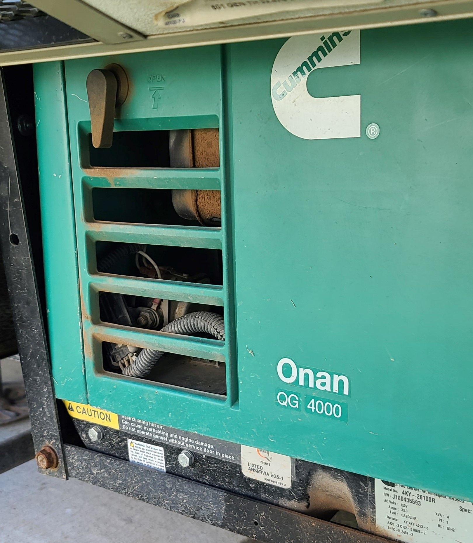 A power inverter is attached to the back of a car seat