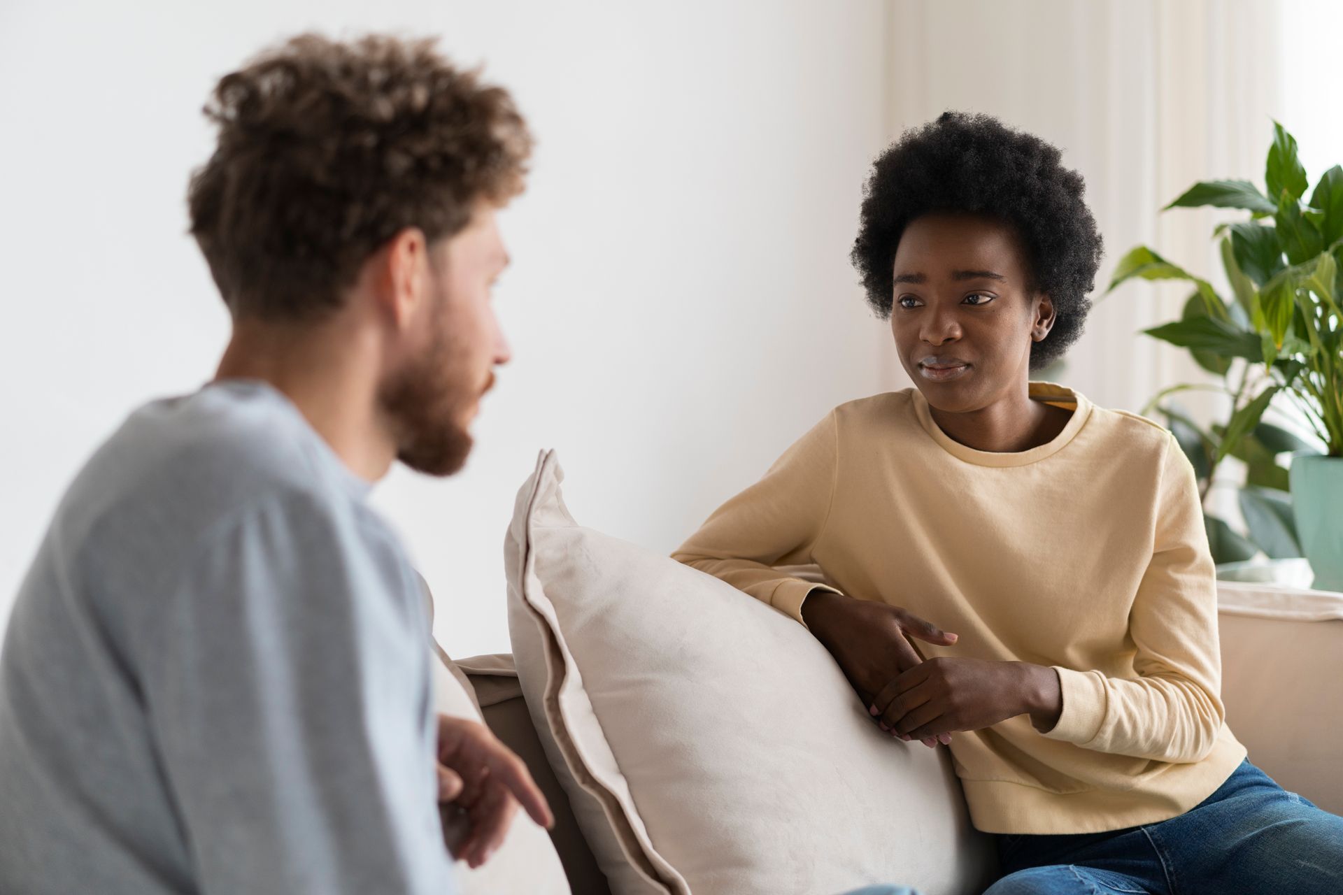 A man and a woman discussing sensitive issues