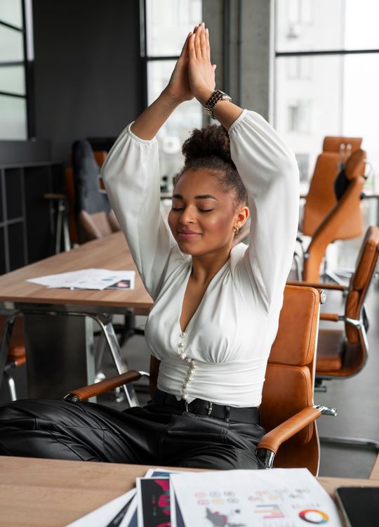 Work colleague practicing mindfulness at her desk