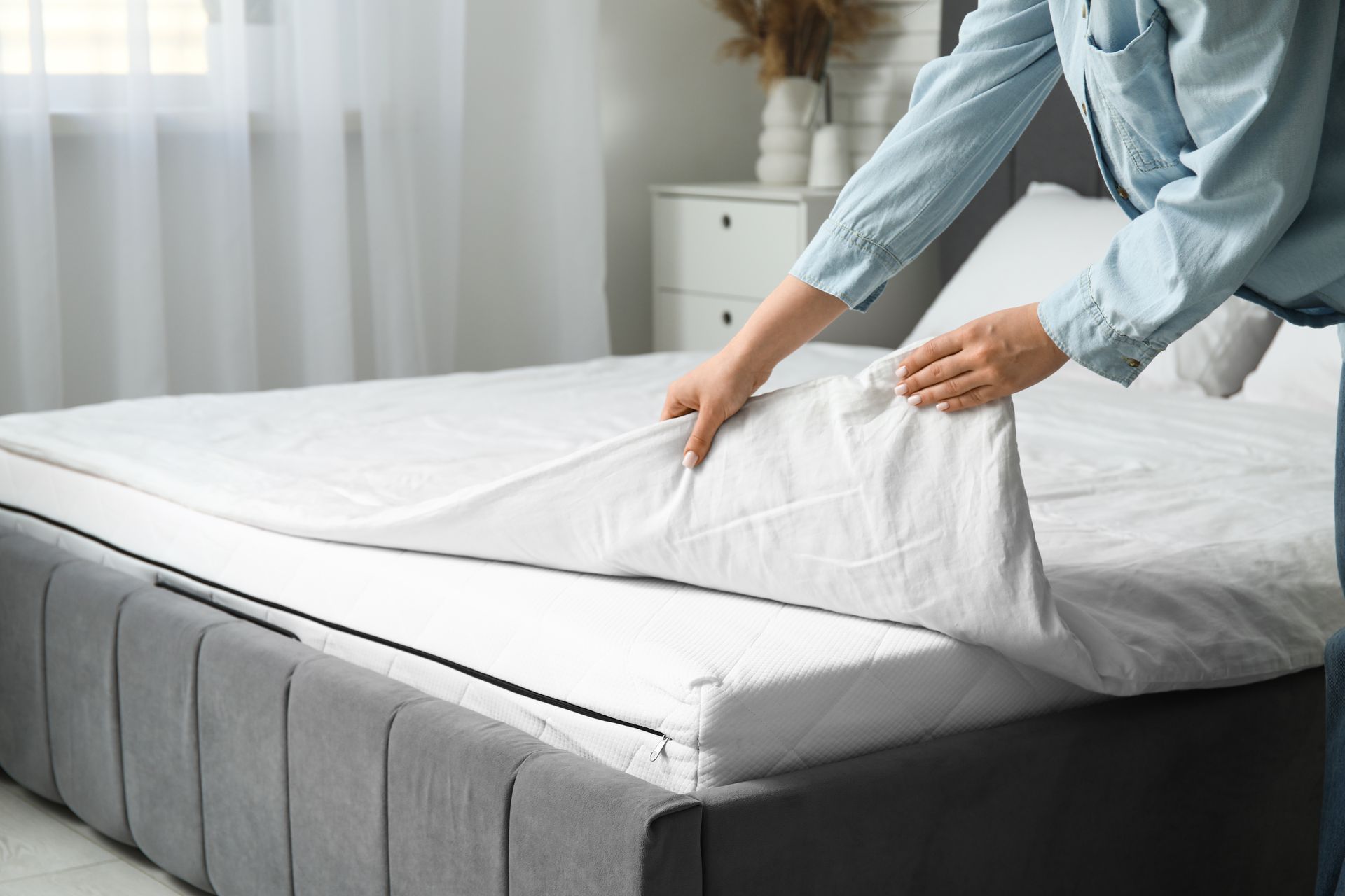 A Bed with White Sheets in A Bedroom — Water Works Waterbeds in Sunshine Coast, QLD