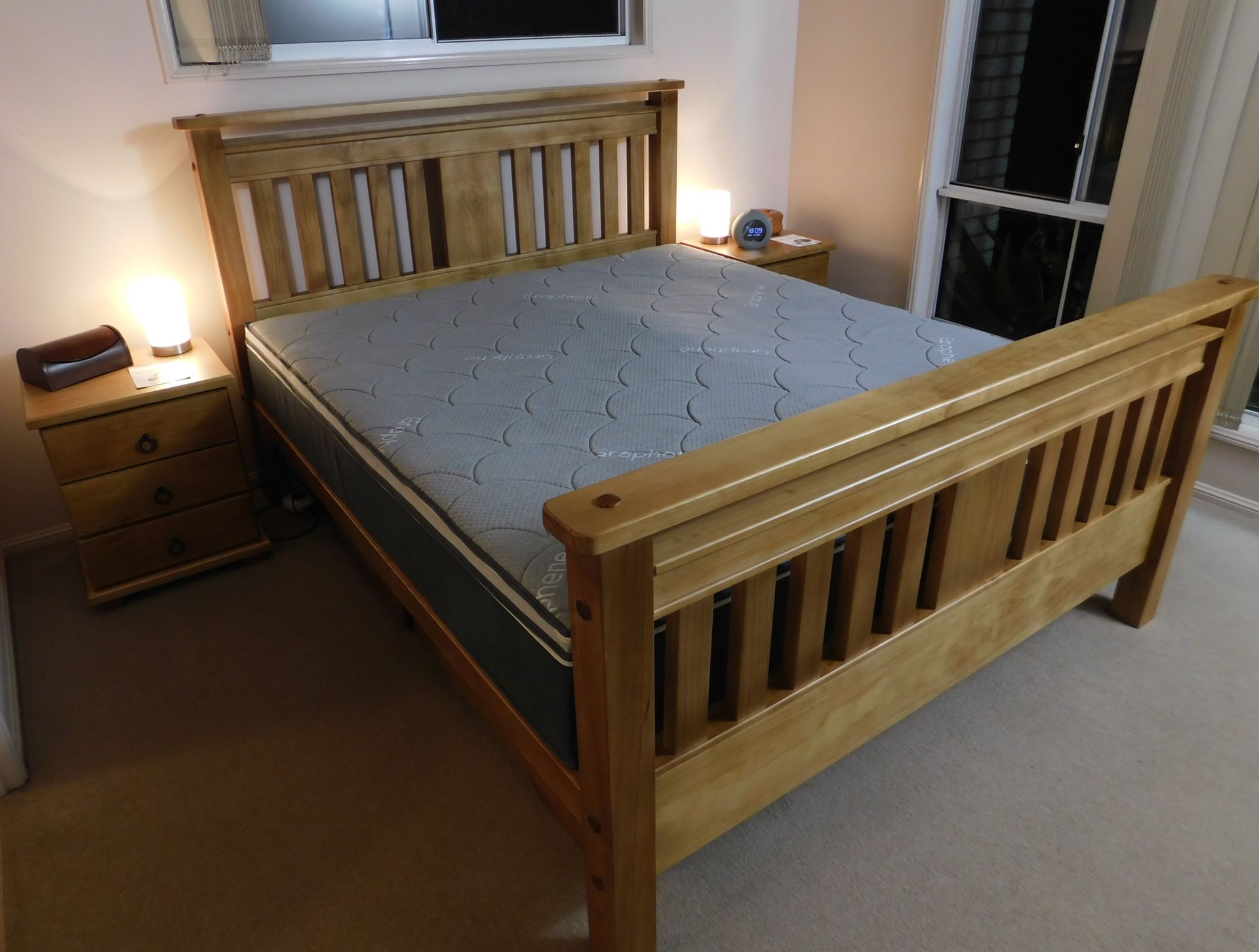 A Wooden Bed in A Bedroom — Water Works Waterbeds in Chermside, QLD
