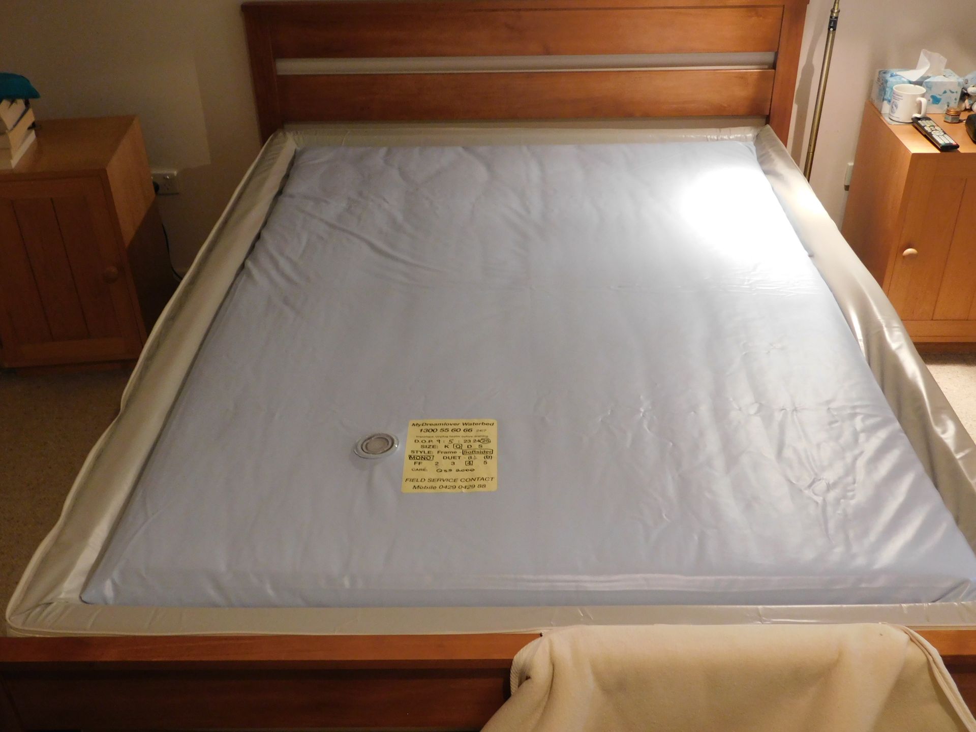 A Bed with Mattress Wrapped in Plastic — Water Works Waterbeds in Chermside, QLD