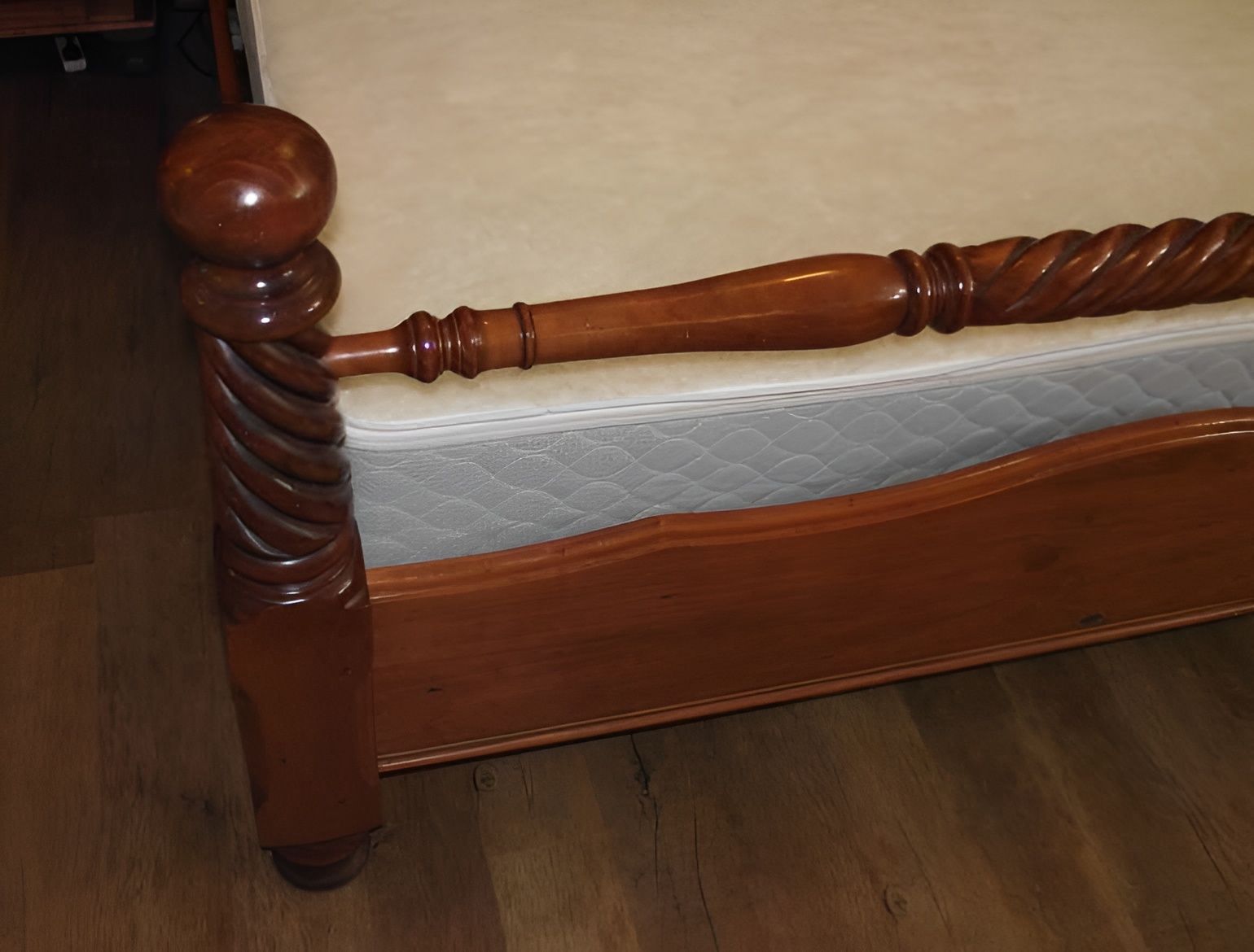 A Wooden Bed Frame with A Carved Headboard and Footboard — Water Works Waterbeds in Chermside, QLD