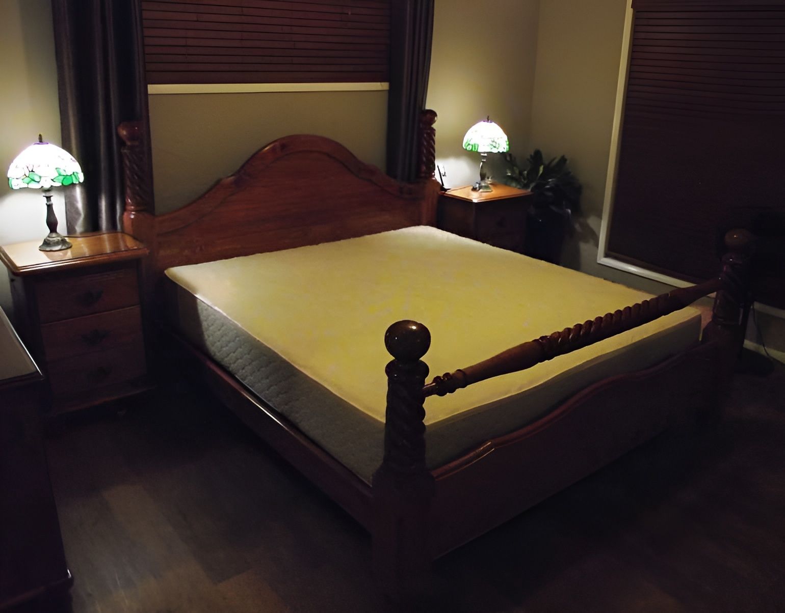 A Bedroom with A Wooden Bed — Water Works Waterbeds in Chermside, QLD