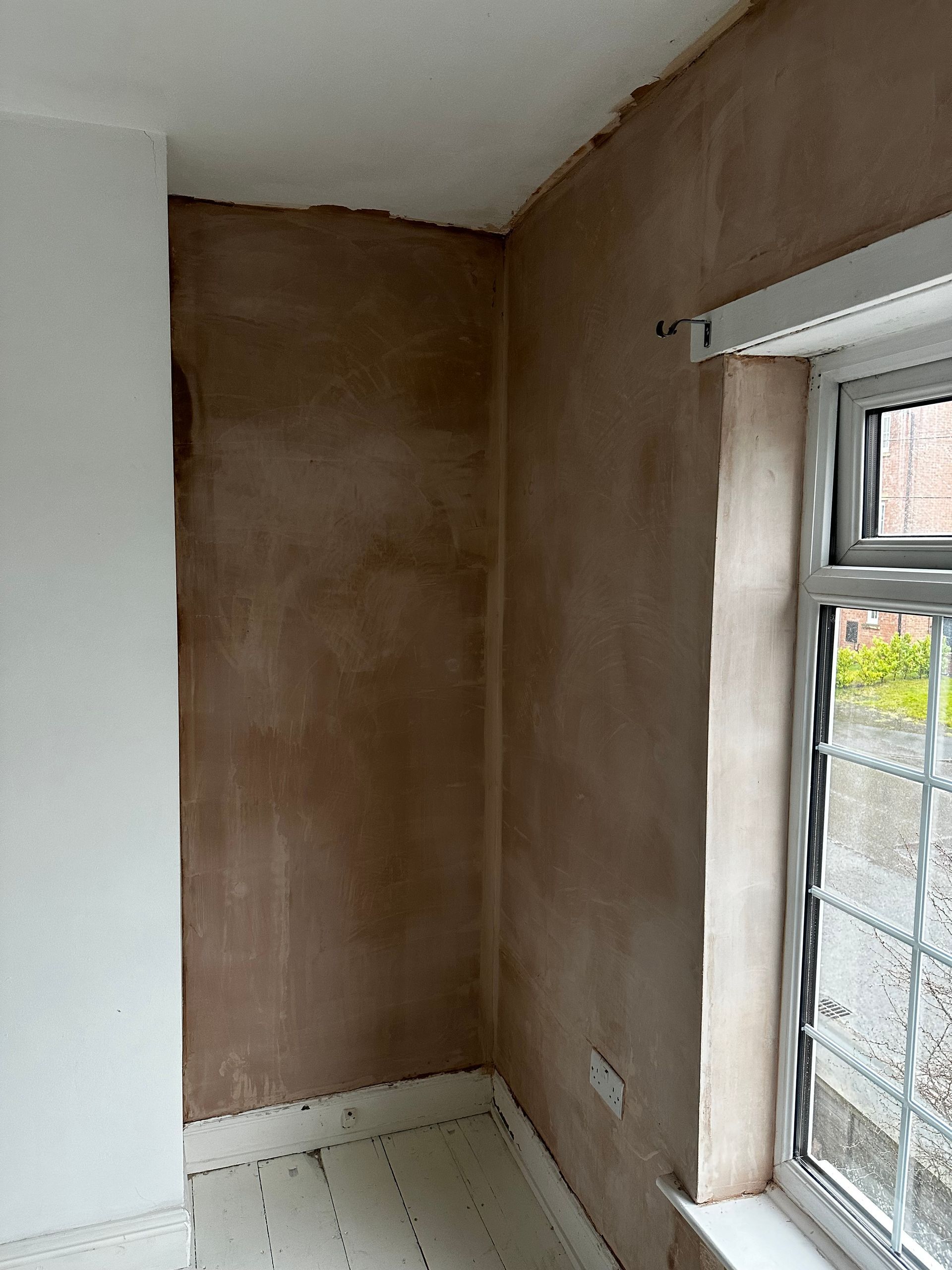 Re-plastering to solid wall in Victorian property 