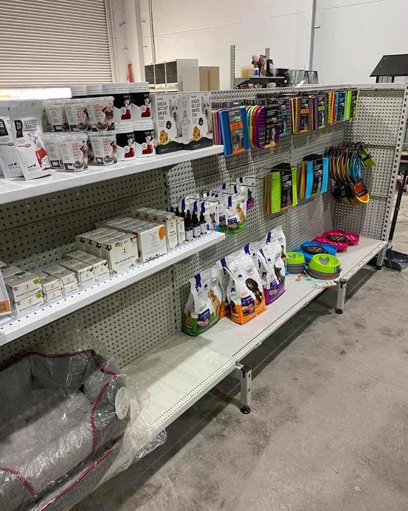 Shelves Stocked With Pet Supplies in a Store — Jonath’s Animal Kingdom in Salamander Bay, NSW