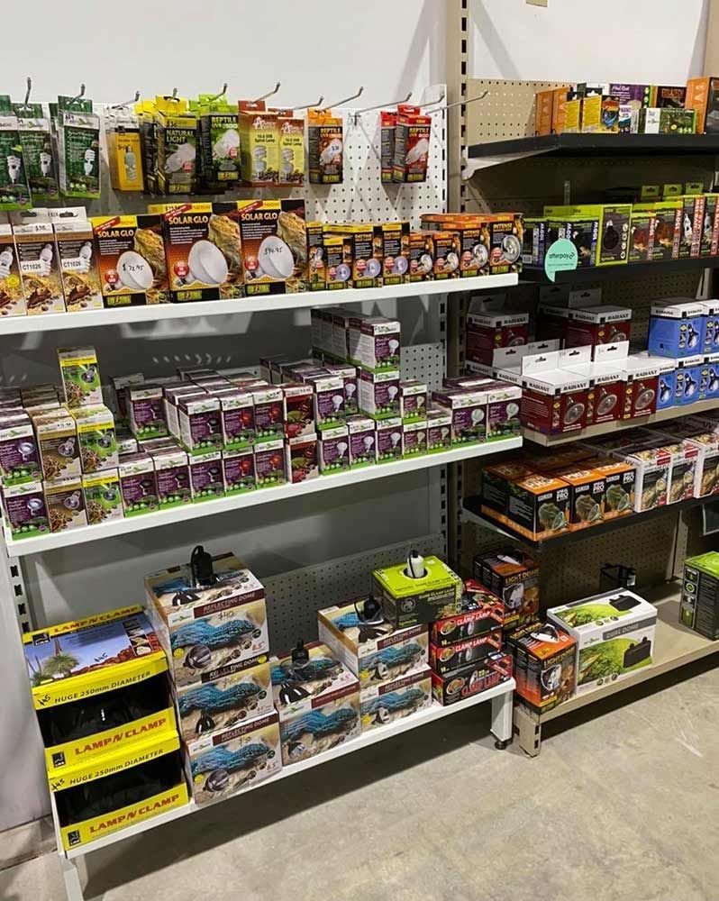 Shelves Stocked With Various Boxed Reptile Supplies — Jonath’s Animal Kingdom in Salamander Bay, NSW
