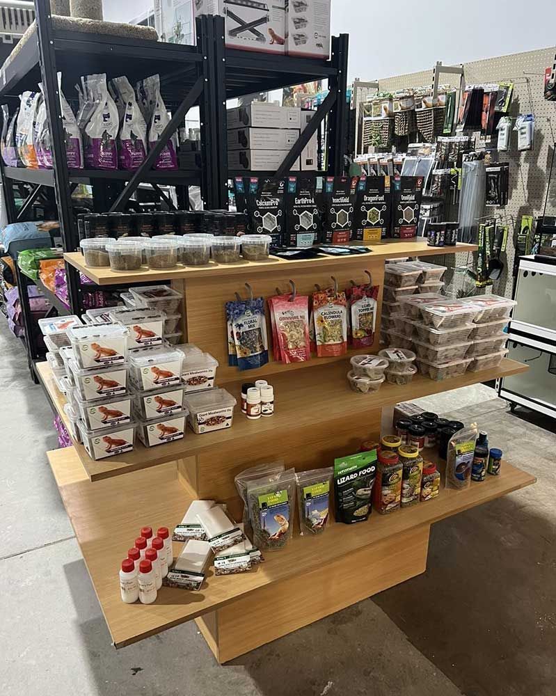 Display of Pet Food and Treats on Wooden Shelves Inside a Store — Jonath’s Animal Kingdom in Salamander Bay, NSW