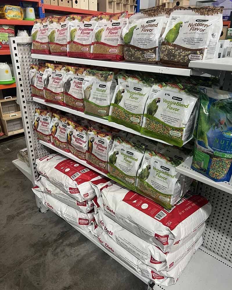 Shelves Stocked With Various Bird Food Bags in a Store — Jonath’s Animal Kingdom in Salamander Bay, NSW