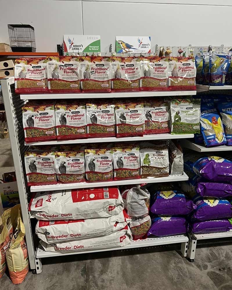 Shelves Stocked With Various Bird Food Products in a Store — Jonath’s Animal Kingdom in Salamander Bay, NSW
