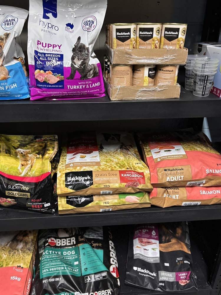 Shelves Stocked With Various Dog Food Bags and Canned Food — Jonath’s Animal Kingdom in Salamander Bay, NSW