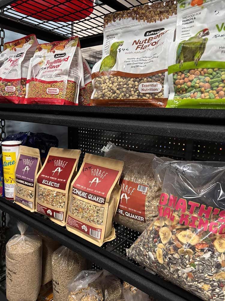 Shelves Stocked With Bird Food Packages, Including Seed Mixes and Treats — Jonath’s Animal Kingdom in Salamander Bay, NSW