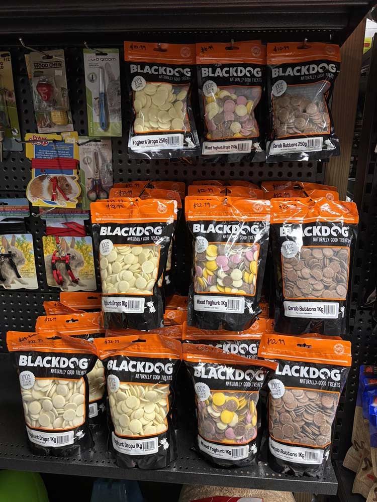 Shelves Stocked With Various Blackdog Brand Dog Treats in Colourful Pouches — Jonath’s Animal Kingdom in Maitland, NSW