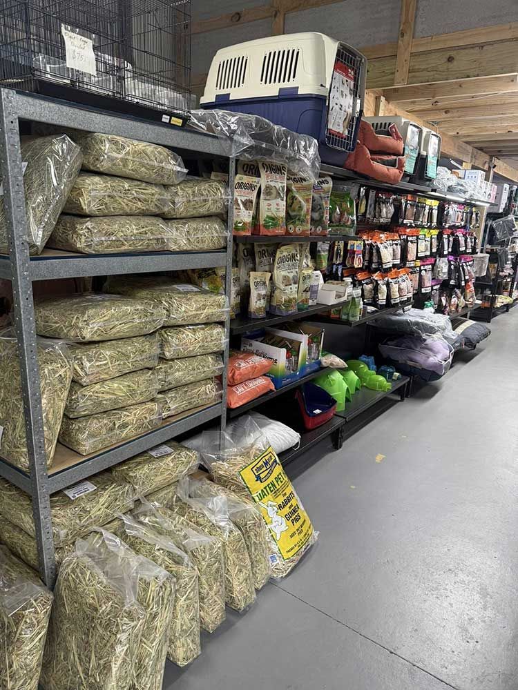 Shelves in a Pet Store Stocked With Bags of Hay and Pet Supplies — Jonath’s Animal Kingdom in Maitland, NSW