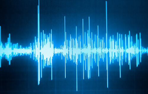 Blue waveform on a black background, representing audio.