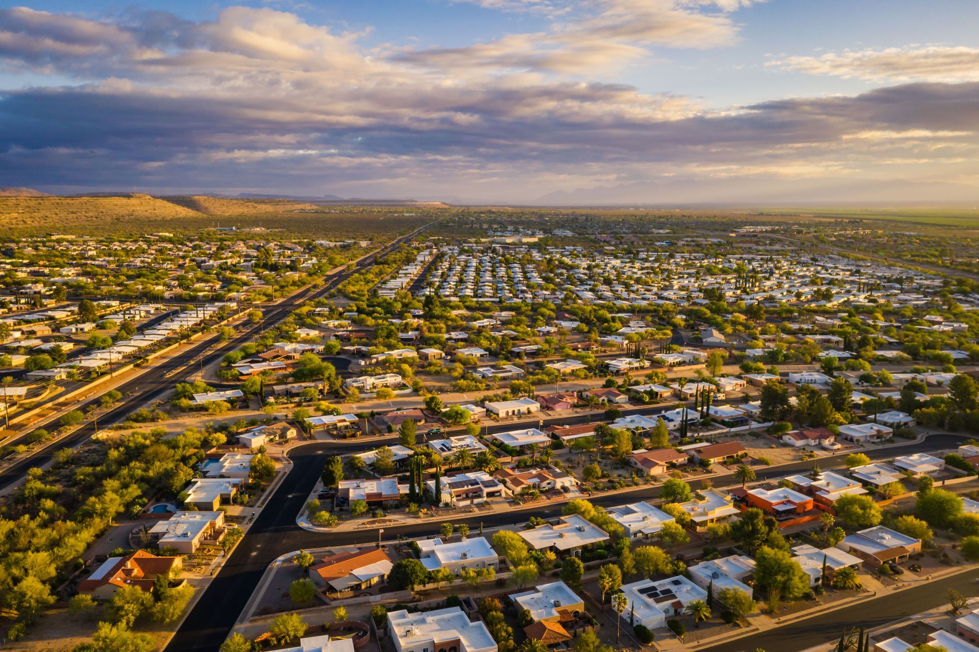 An aerial view of a residential area with lots of houses and trees.