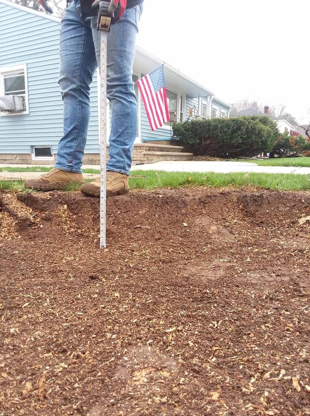 Worker With Measuring Meter — Appleton, WI — Powerhouse Stumpin