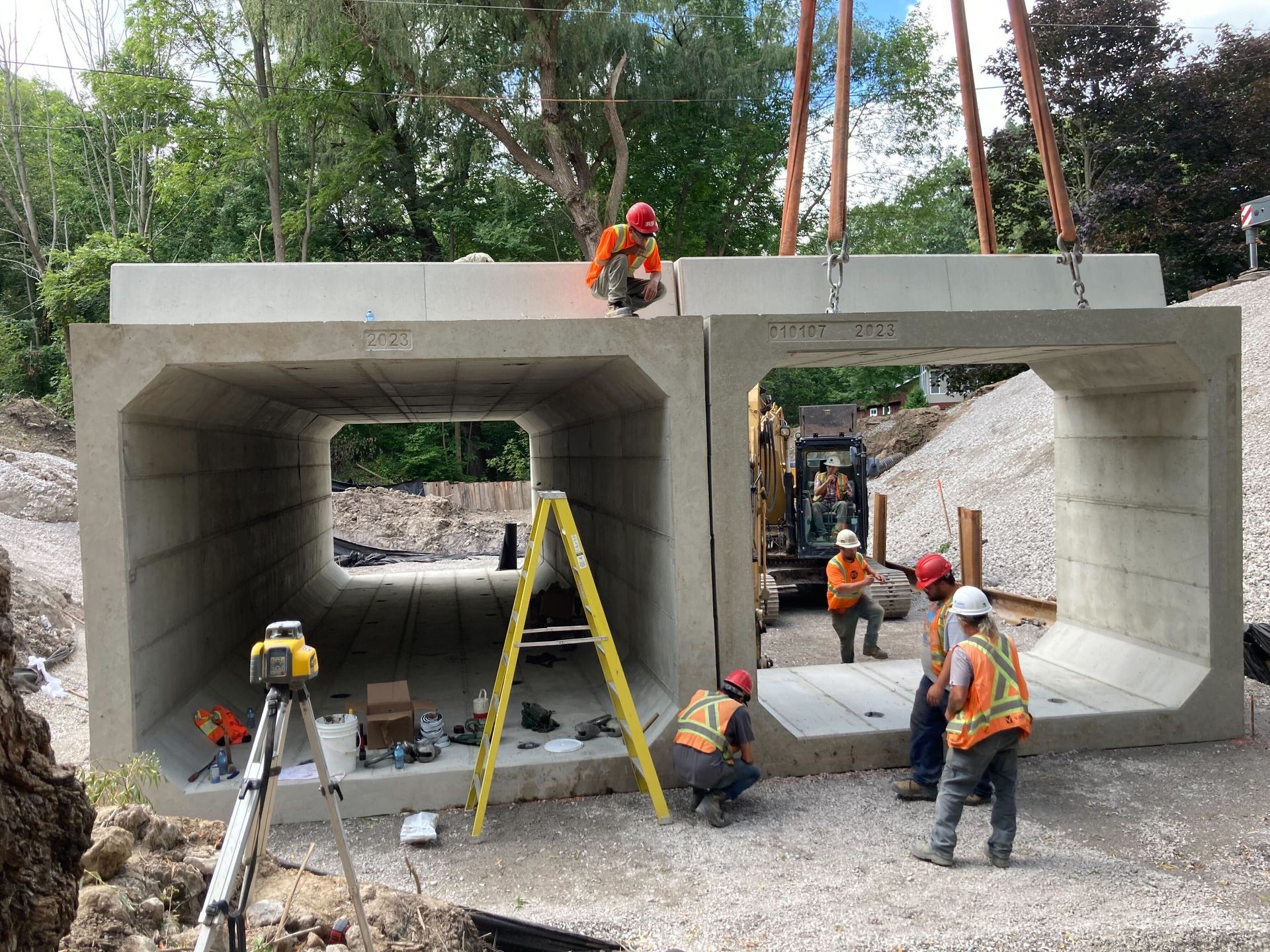 A group of construction workers are working on a concrete structure.