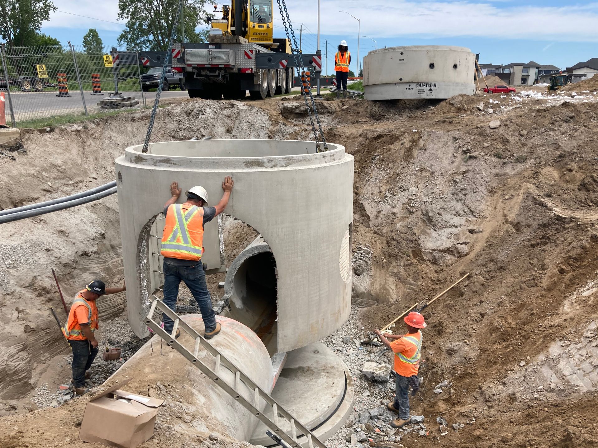 A group of construction workers are working on a construction site.