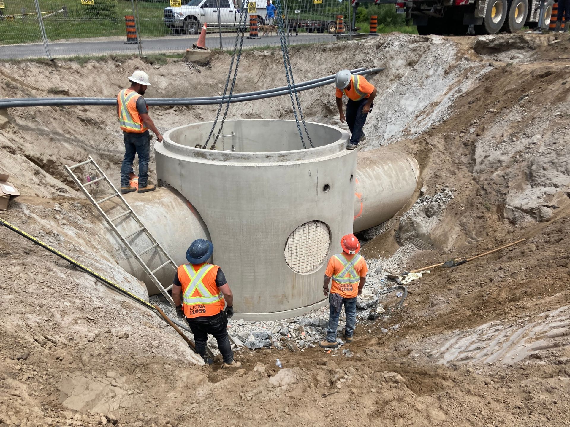 A group of construction workers are working on a construction site.