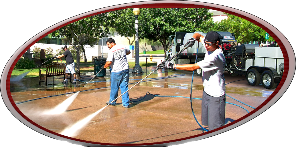 Two men are using a high pressure washer to clean a sidewalk